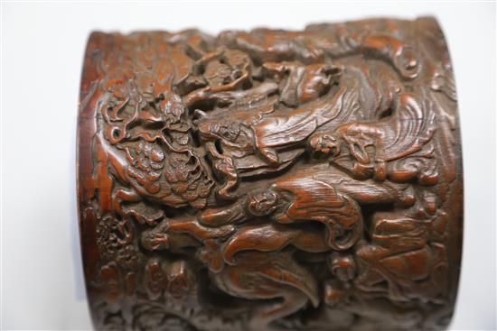 A Chinese bamboo eighteen luohan brush pot, late Qing dynasty, H.14cm